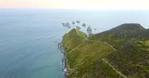 Aerial view of Nugget Point Lighthouse at sunset, NewZealand. Stock Footage 73127899