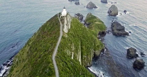Aerial view of Nugget Point Lighthouse at sunrise, south island, NewZealand. Stock Footage 73128098