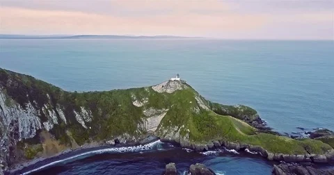 Aerial view of Nugget Point Lighthouse at sunrise, south island, NewZealand. Stock Footage 73128206