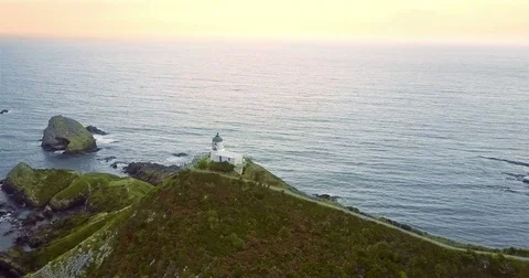 Aerial view of Nugget Point Lighthouse at sunrise, south island, NewZealand. Stock Footage 73128260