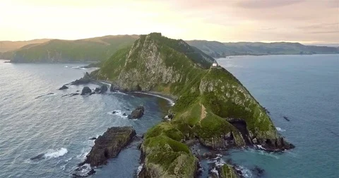 Aerial view of Nugget Point Lighthouse at sunrise, south island, NewZealand. Stock Footage 73128262