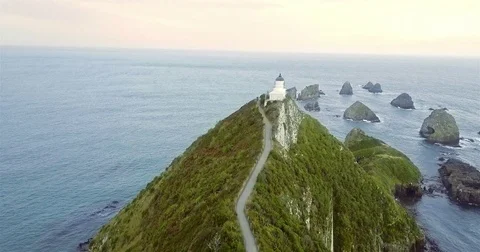 Aerial view of Nugget Point Lighthouse at sunrise, south island, NewZealand. Stock Footage 73128331