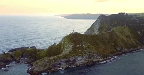 Aerial view of Nugget Point Lighthouse at sunrise, south island, NewZealand. Stock Footage 73128345