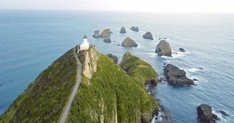 Aerial view of Nugget Point Lighthouse at sunrise, south island, NewZealand. Stock Footage 73128382