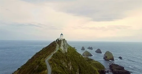 Aerial view of Nugget Point Lighthouse at sunrise, south island, NewZealand. Stock Footage 73128421