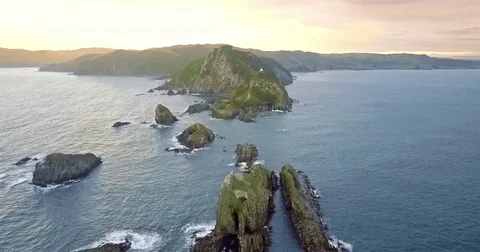 Aerial view of Nugget Point Lighthouse at sunrise, south island, NewZealand. Stock-Footage 73128433
