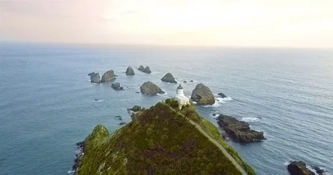 Aerial view of Nugget Point Lighthouse at sunrise, south island, NewZealand. Stock-Footage 73128447