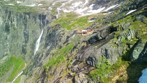 Aerial view of observation deck at Stigfossen waterfall by famous mountain road Stock Footage 251920452