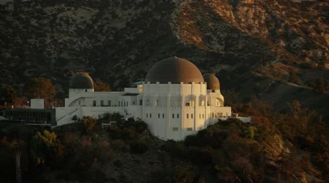 Aerial view of Observatory at Griffith Park Los Angeles at sunrise Stock Footage 64775321