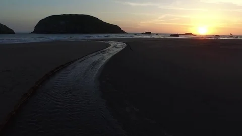 Aerial View of Ocean and Sandy Beach at Sunset 스톡 동영상 71160975