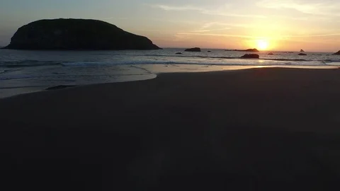 Aerial View of Ocean and Sandy Beach at Sunset Video stock 71160977