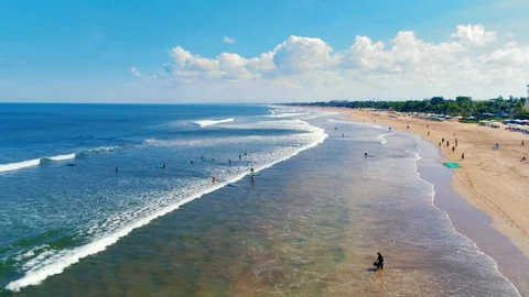 Aerial view of the ocean beach and surfers Stock Footage 108536601