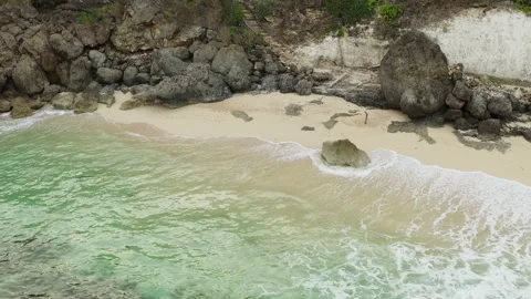 Aerial view of ocean blue waves break on a beach. Beautiful sand beach. Stock Footage 136782397