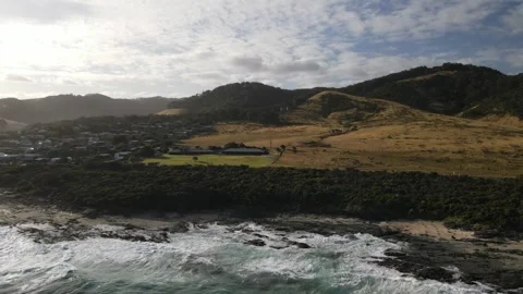 Aerial view of ocean coast and mountains at sunset Stock Footage 336001076