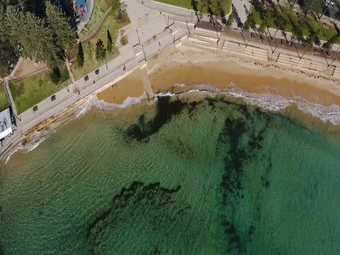 Aerial view Ocean Rock Pool Promenade Embankment and white sandy beach Stock Footage 70770183