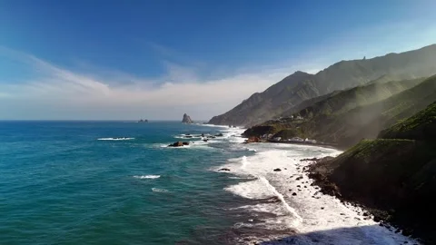 Aerial view of ocean sun rays and Roque de las Bodegas, Tenerife Stock Footage 336446941