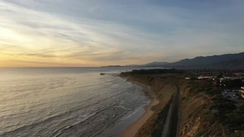 Aerial View of the Ocean at Sunset with Waves Near the Coast Stock Footage 150730742