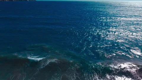 Aerial view of ocean surface in Chile with sunlight reflection 4K Stock Footage 329451330