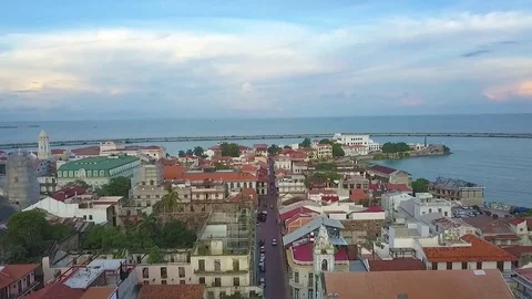 Aerial view of an ocean town at sunset. Stock Footage 80607895