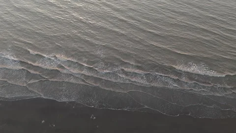 AERIAL VIEW OF OCEAN WAVE AT EVENING TIME. Stock Footage 258469295