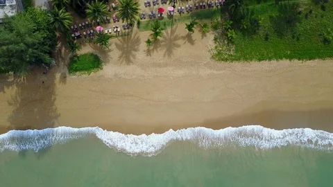 Aerial view of ocean wave reaching the beach near resort Stock-Footage 91087225