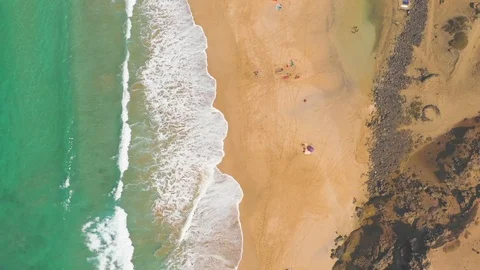 Aerial View Of Ocean Waves and rock of Cotillo in Fuerteventura island Stock Footage 119588404