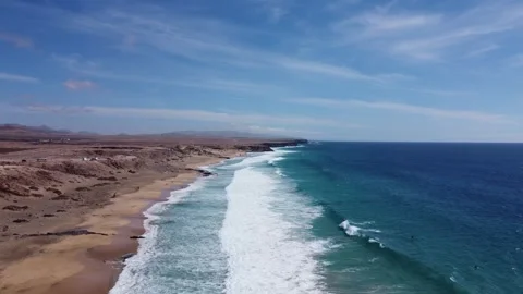 Aerial view of ocean waves and surfers, fuerteventura, spain Video stock 286721592