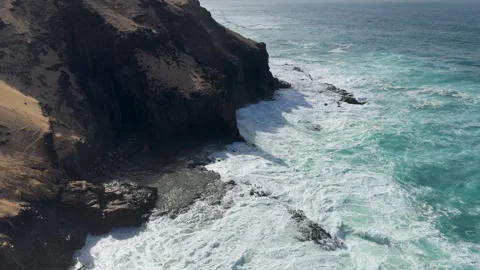 Aerial view of ocean waves and rocky volcanic coastline 스톡 동영상 331195818