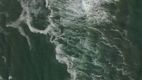 Aerial view of ocean waves and sea foam patterns, natural water texture Video stock 336295551