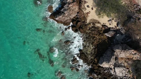 Aerial view. of ocean waves, beach and rocky coastline and beautiful forest. Bea Video stock 102121854