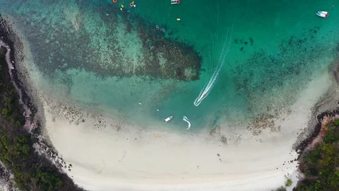 Aerial view of ocean waves, beach and rocky coastline and beautiful forest  Video stock 108667450