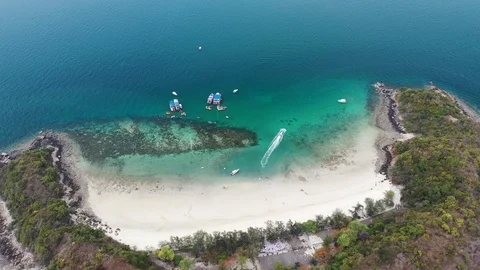 Aerial view of ocean waves, beach and rocky coastline and beautiful forest Stock Footage 108957963