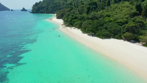 Aerial view of ocean waves, beach and rocky coastline and beautiful forest Stock Footage 123709193