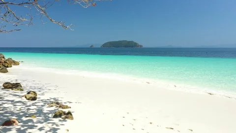 Aerial view of ocean waves, beach and rocky coastline and beautiful forest Stock Footage 125321641
