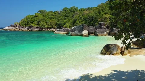 Aerial view of ocean waves, beach and rocky coastline and beautiful forest 動画素材 125683016