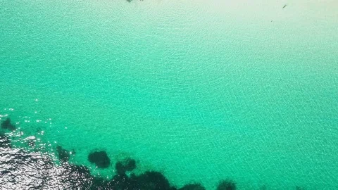 Aerial view of ocean waves, beach and rocky coastline and beautiful forest Stock Footage 126099673