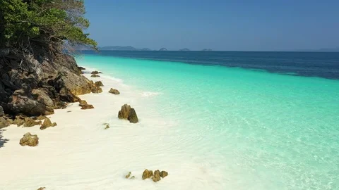 Aerial view of ocean waves, beach and rocky coastline and beautiful forest Stock Footage 126100071