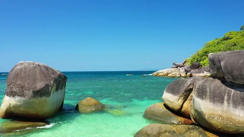 Aerial view of ocean waves, beach and rocky coastline and beautiful forest Stock Footage 126100073