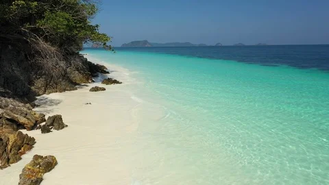 Aerial view of ocean waves, beach and rocky coastline and beautiful forest Stock Footage 127430516