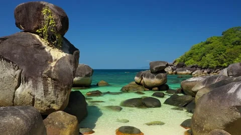 Aerial view of ocean waves, beach and rocky Stock Footage 141523778