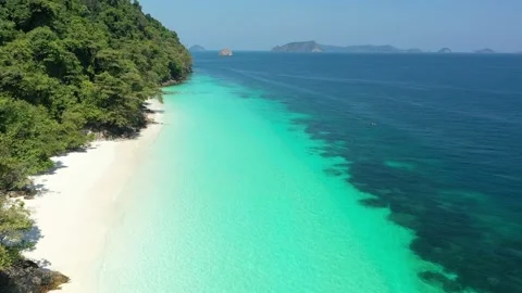 Aerial view of ocean waves, beach and rocky coastline and beautiful forest Stock Footage 142301240