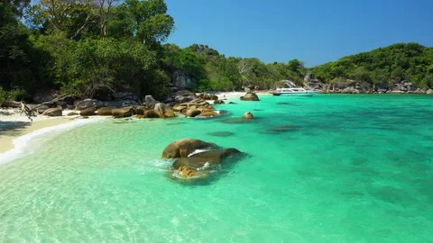 Aerial view of ocean waves, beach and rocky coastline and beautiful forest Stock Footage 142301320