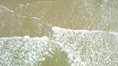 Aerial view. of ocean waves, beach and rocky coastline and beautiful forest. Video stock 150379646