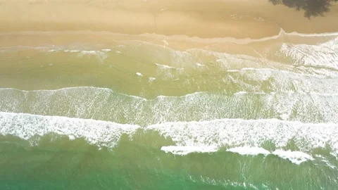 Aerial view. of ocean waves, beach and rocky coastline and beautiful forest. Video stock 150379753