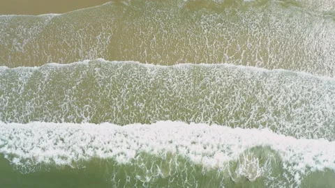 Aerial view. of ocean waves, beach and rocky coastline and beautiful forest. Video stock 150379772