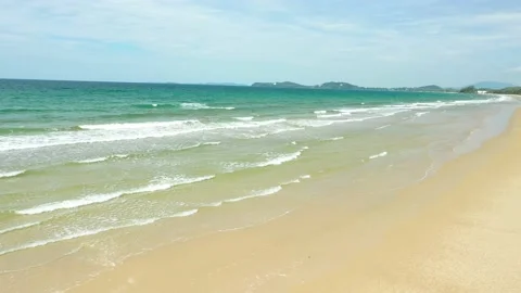 Aerial view. of ocean waves, beach and rocky coastline and beautiful forest. Video stock 150379826