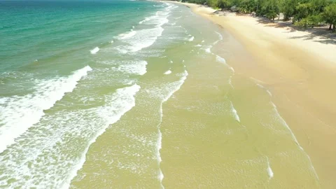 Aerial view. of ocean waves, beach and rocky coastline and beautiful forest. Video stock 150379841