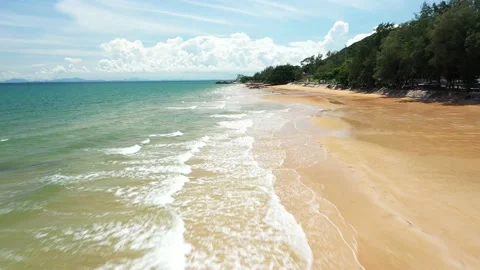 Aerial view. of ocean waves, beach and rocky coastline and beautiful forest Stock Footage 151337034
