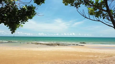 Aerial view. of ocean waves, beach and rocky coastline and beautiful forest Stock Footage 151337155