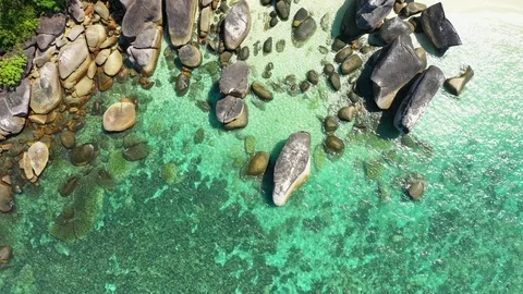 Aerial view of ocean waves, Beautiful tropical beach and rocky  Stock Footage 123849651
